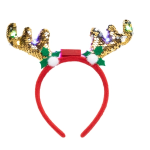 Detail of red and gold Christmas reindeer antler headband with LED lights and sequins