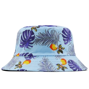 Detail of the stitching on light blue bucket hat with tropical leaf floral print
