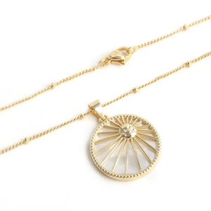 Vintage 18K gold plated sun necklace with shell pendant and micro-set cubic zirconia