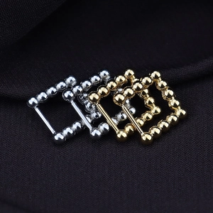Minimalist egg-shaped steel bead hoop earrings in polished gold and silver finishes