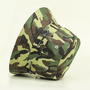 Detail view of camouflage hiking bucket hat with metal eyelets and decorative sport strap