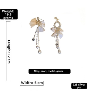 Detailed size and weight view of bow tassel earrings with pearls and crystal chains
