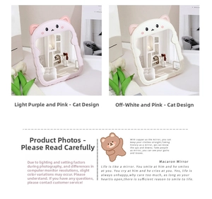 Detail of folding desktop makeup mirrors with cute cat ears in pastel purple and cream