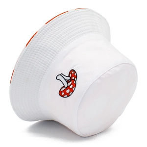 Reversible white cotton bucket hat featuring a cute red mushroom embroidery on pure background
