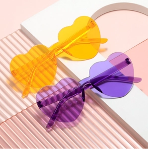 Frameless heart shaped sunglasses in yellow and purple resin for parties and fashion