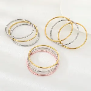 Minimalist 3mm stainless steel bangles set in gold silver and rose gold polished finishes