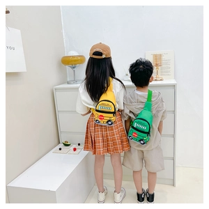 Kids school bus chest bags in yellow and green worn by children in a bright interior