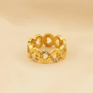 Detailed view of gold-plated hollow heart ring with sparkling crystal stone settings