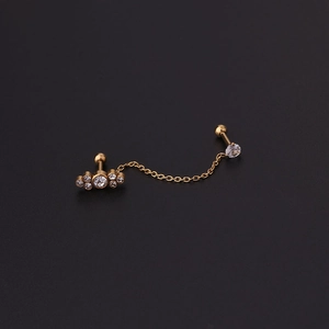 Detail of 16G gold chain earrings with sparkling zircons for double ear piercings