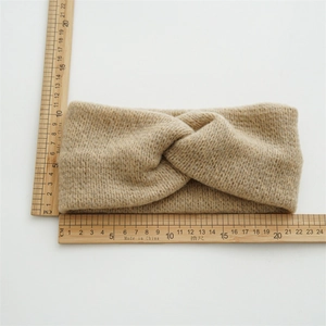 Camel knitted crossover headband with thick ribbed texture shown with measurement tools