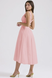 Detail of pink summer maxi dress showing V-back design and elegant pleated waist detail