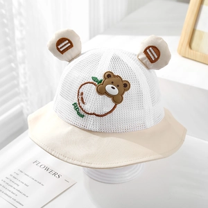 Macro detail of breathable mesh baby sun hat with cute bear and apple embroidery