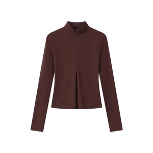 Detail of dark brown slim fit yoga top featuring a stand collar and half-zipper design