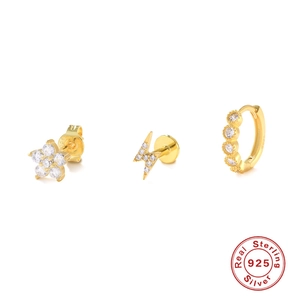 Close-up of gold 925 silver earring set featuring flower, lightning and hoop designs