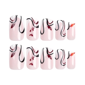 French style press-on nails with black wavy lines and red autumn leaf designs