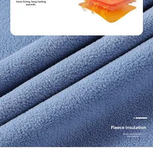Detailed macro view of dense blue polar fleece fabric with thermal layer structure diagram