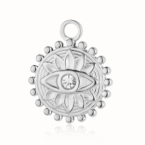 Macro shot of silver evil eye pendant with natural stone and beaded edge details