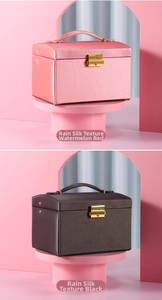 Detail of rain-pattern jewelry boxes with golden metal clasps and leather handles