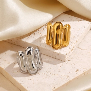 Lava texture geometric oval rings in gold and silver finish with polished surface
