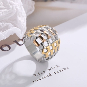 Detail view of woven three-tone mesh ring in silver, gold, and rose gold finishes