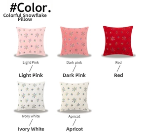 Detail showing five colors of snowflake embroidered pillowcases in plush fabric