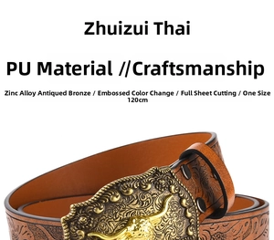 Close-up of western cow head buckle and embossed pattern on brown leather belt