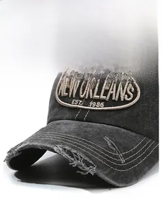 Detail of vintage washed black cotton baseball cap with New Orleans letter embroidery