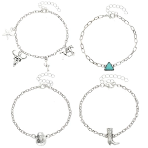 Close-up of Western style silver bracelets with star, bull head and cactus charms
