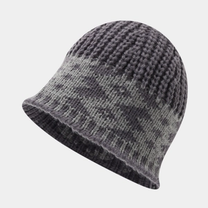 Detail of grey knitted bucket hat featuring thick wool texture and warm winter weave