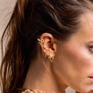 Minimalist S925 sterling silver gold snake cuff earring set worn on female model's ear