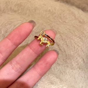Detailed view of vintage horse relief ring with brown enamel and gold plating