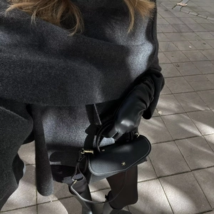 British style chic black leather handbag with long gloves and charcoal grey scarf for women