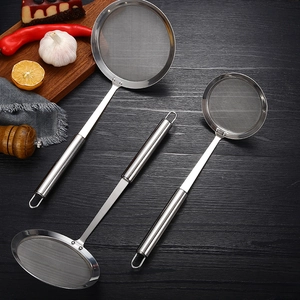 Set of three stainless steel fine mesh oil strainers with tubular handles on wood background