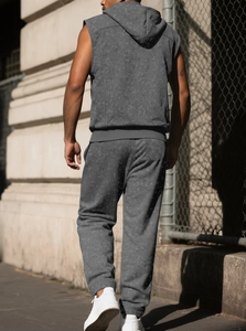 Close-up of grey sleeveless hoodie and joggers set with brushed snowflake texture fabric