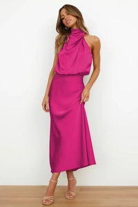 Detail showing high-quality rose red satin fabric texture on an elegant halter maxi dress