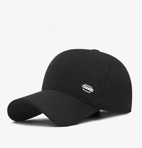 Detail view of the black winter baseball cap featuring thick wool fabric and side logo