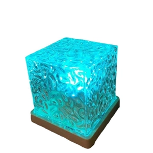 Cube-shaped water ripple projector night light with blue ocean wave lighting effect