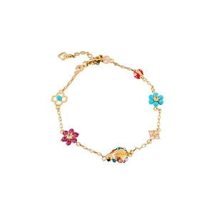 Golden bracelet with colorful ladybug and flower pendants on a clean white background