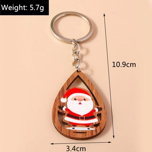 Détail du porte-clés Père Noël en bois avec dimensions 10,9x3,4cm et poids de 5,7g
