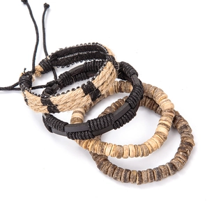 Detailed view of 4-piece vintage leather bracelet set with woven ropes and wooden beads