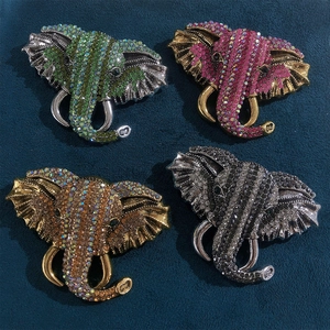 Vintage elephant head brooches with colorful rhinestones in four elegant metallic finishes