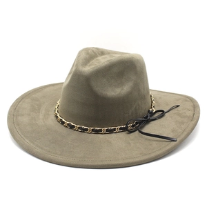 Detailed view of an olive green faux suede fedora featuring a gold chain and leather bow