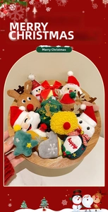 Close-up of cute plush Santa and reindeer badges with festive embroidery and glitter