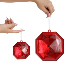 Red geometric acrylic Christmas tree ornaments in various sizes with white hanging ropes