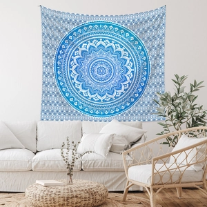 Detail of blue mandala bohemian tapestry hanging on white wall in minimal living room