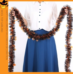 Lengthy Halloween garland with black metallic tinsel and orange pumpkin head accents