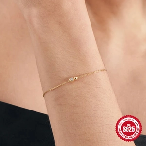 Minimalist S925 sterling silver ball bracelet with cubic zirconia on woman's wrist