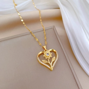 Luxurious gold heart necklace with sparkling sunflower pendant and diamond accents