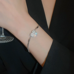 Elegant silver multi-strand bracelet with a sparkling diamond heart pendant for women