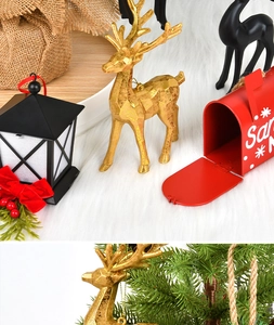 Detailed Christmas ornaments featuring golden reindeer and red Santa mailbox decorations
